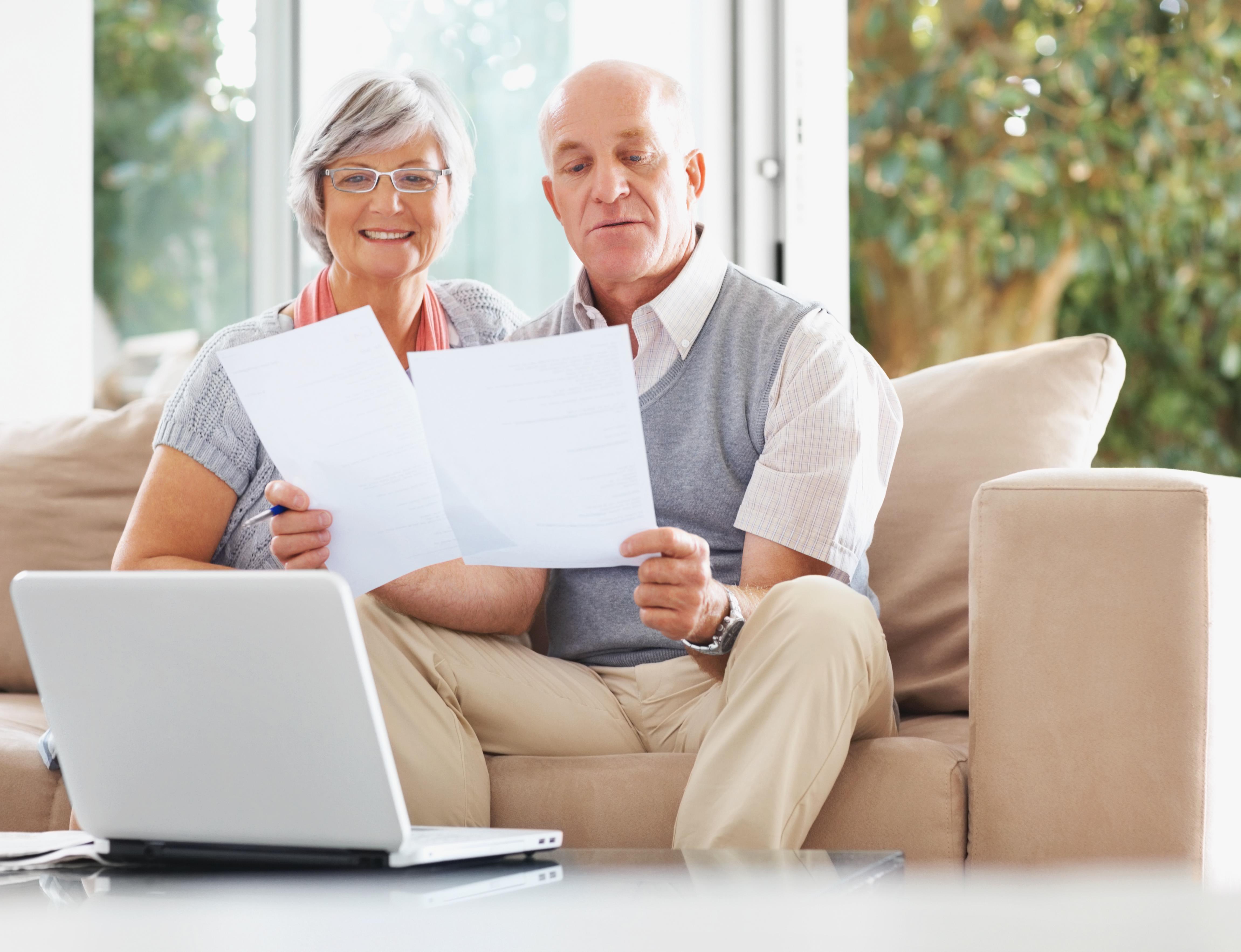 Senior Couple Reading Document - IVA and PPI